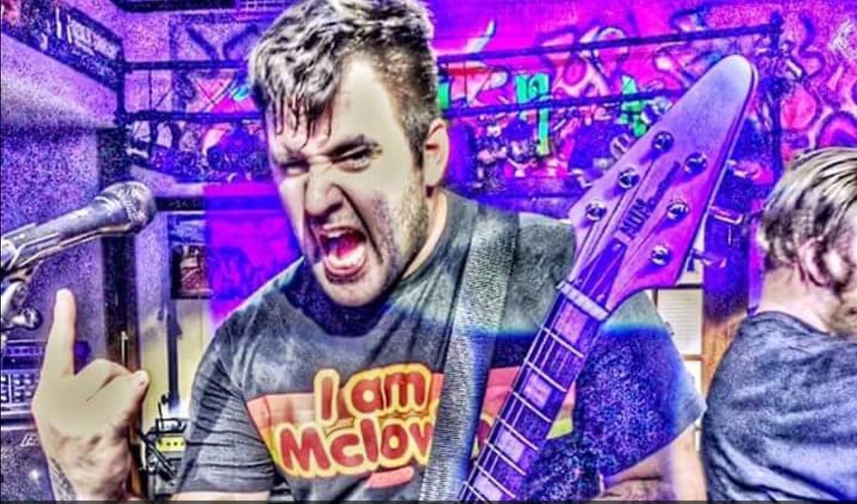 Matt Omiatek of Hero Turned Hand Grenade playing his custom MUM guitar