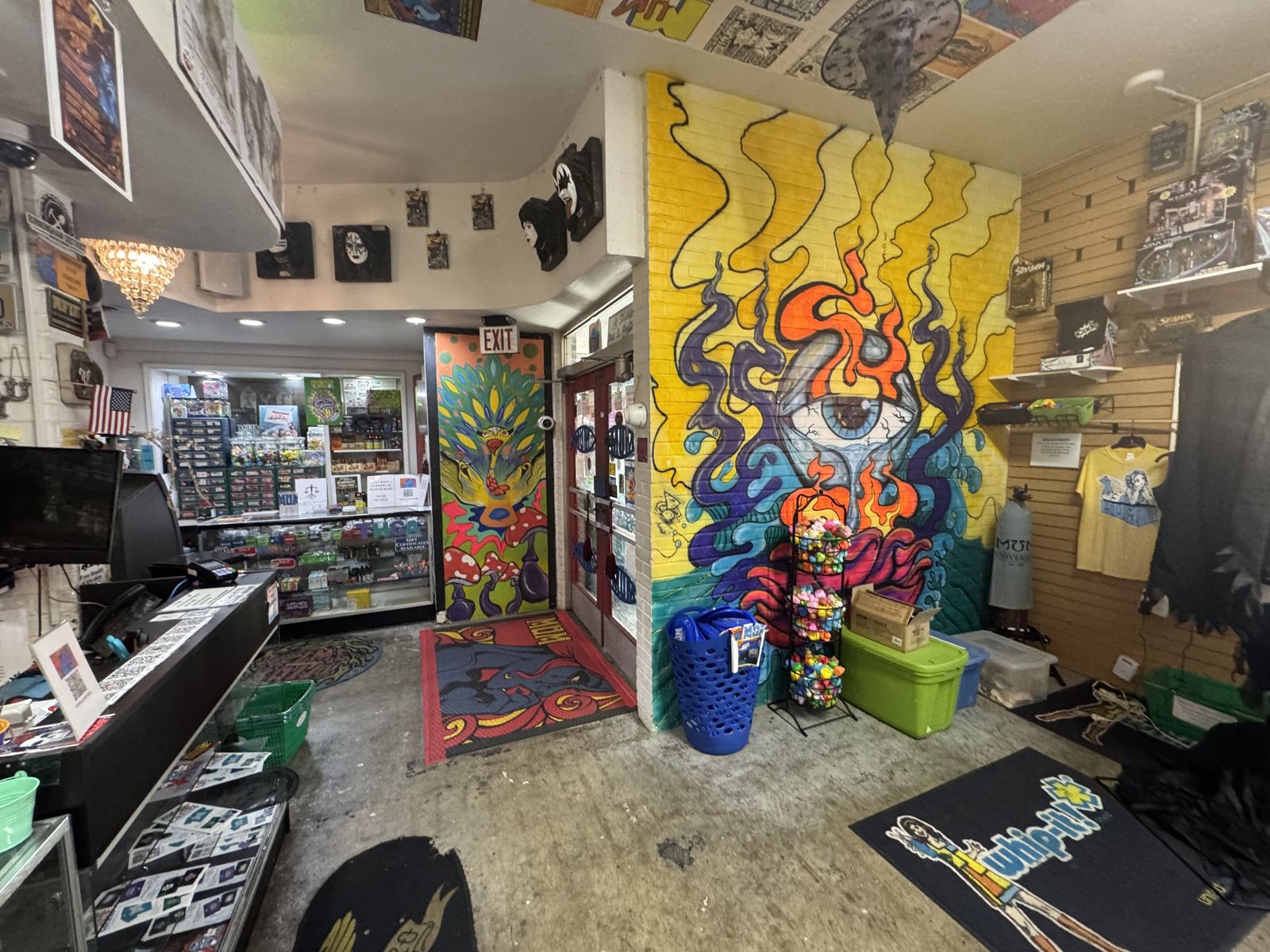 Inside MUM today: the counter, gear, posters and the big painted wall